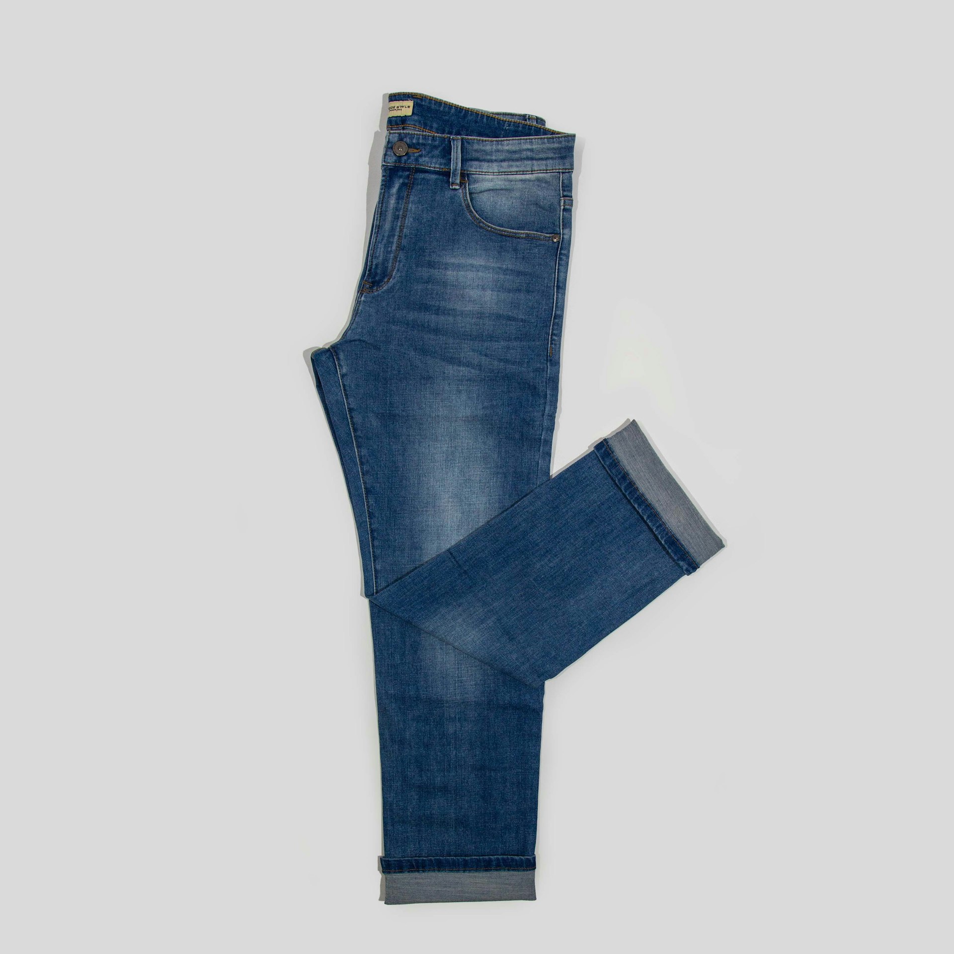 a pair of blue jeans on a white background